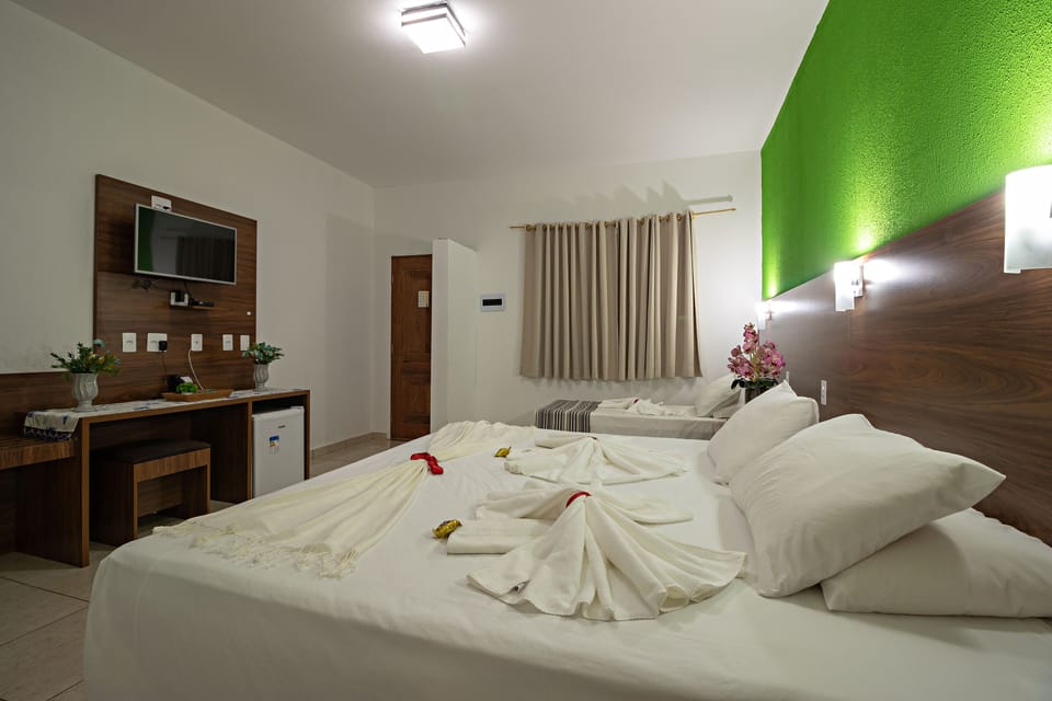 Luxury Quadruple Room | Minibar, in-room safe, desk, laptop workspace