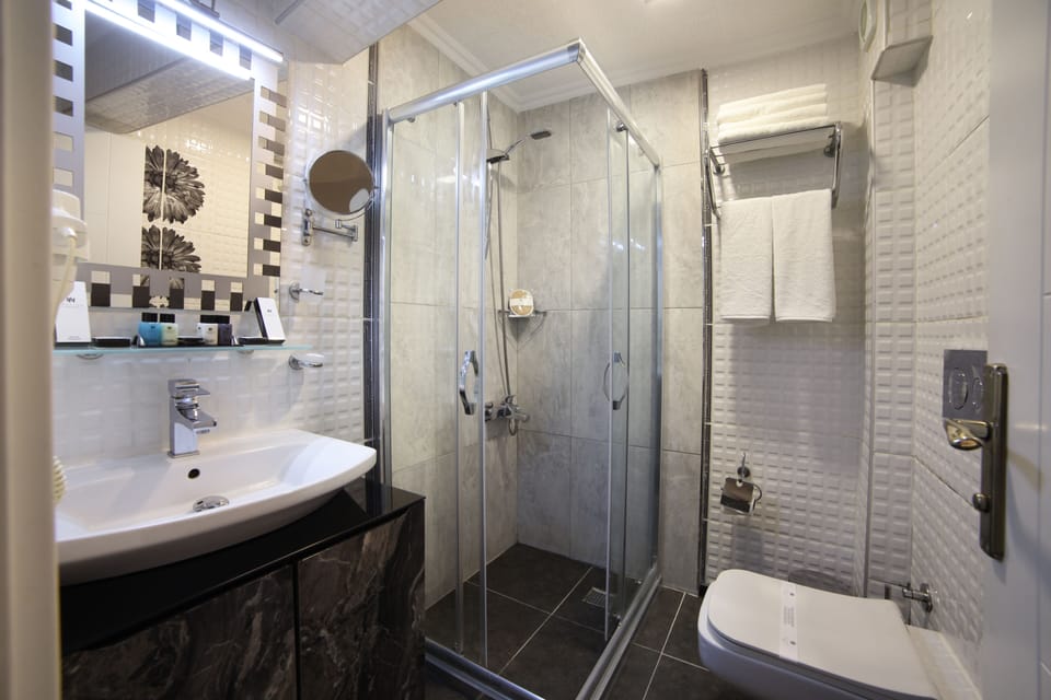 Shower, free toiletries, hair dryer, slippers