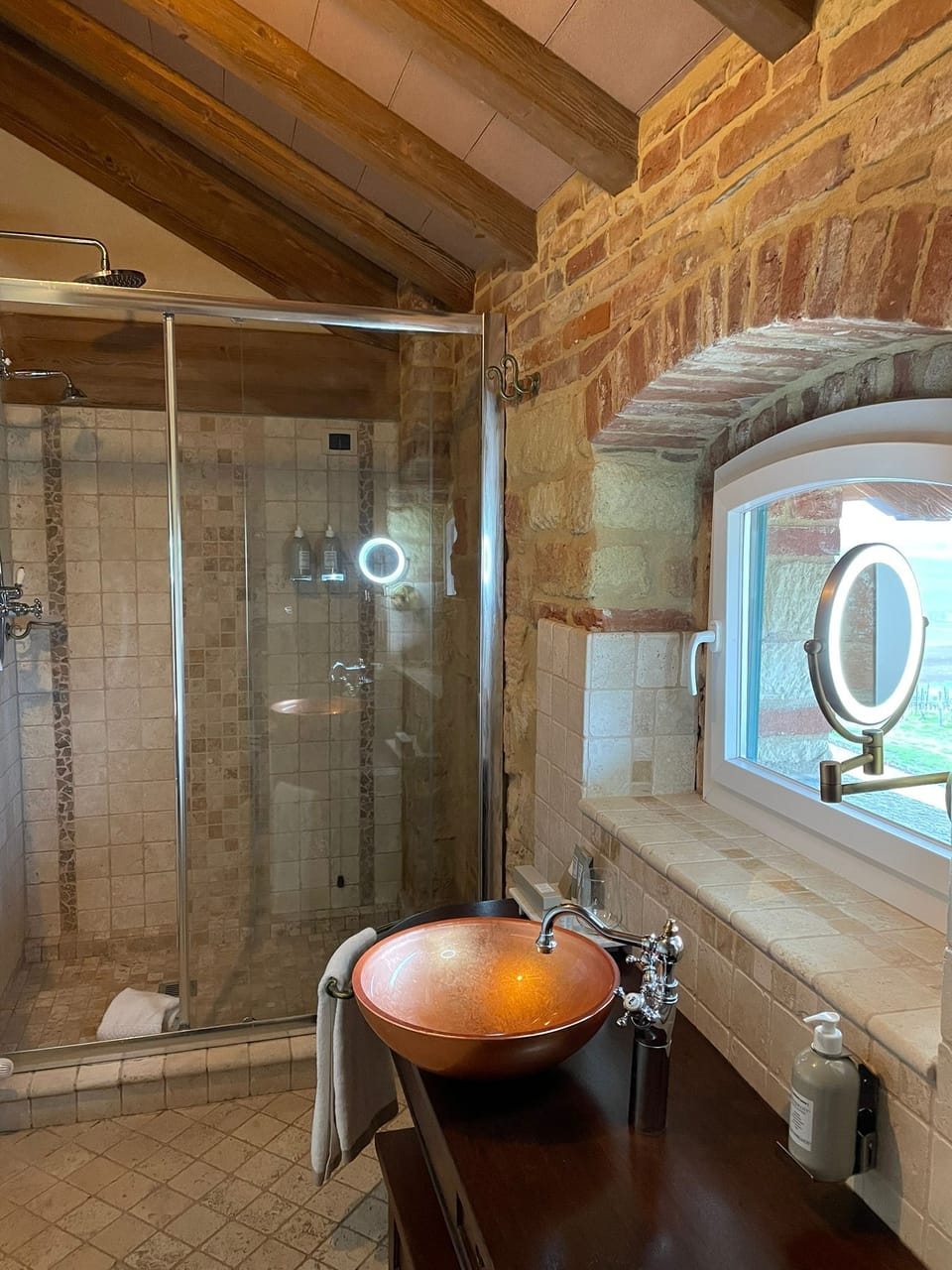 Junior Suite, Courtyard View | Bathroom | Shower, rainfall showerhead, designer toiletries, hair dryer