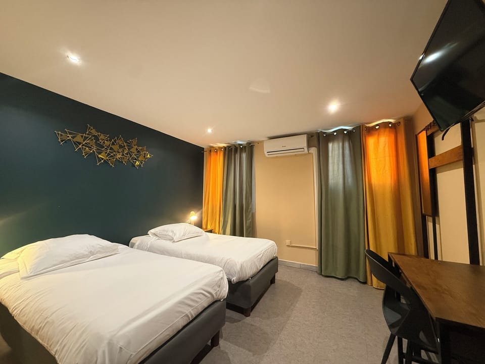 Standard Twin Room | Desk, laptop workspace, blackout drapes, iron/ironing board