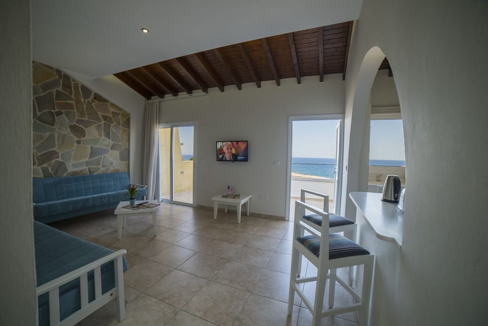 Apartment, 1 Bedroom, Sea View | Living area | Flat-screen TV