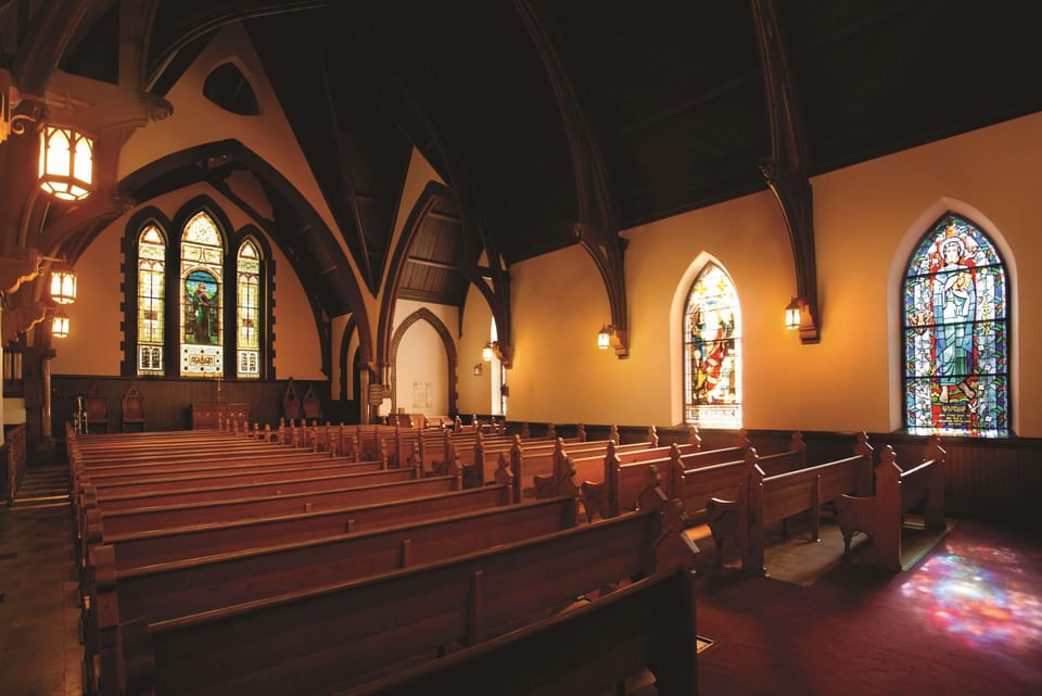 Premium bedding, desk, laptop workspace, blackout drapes