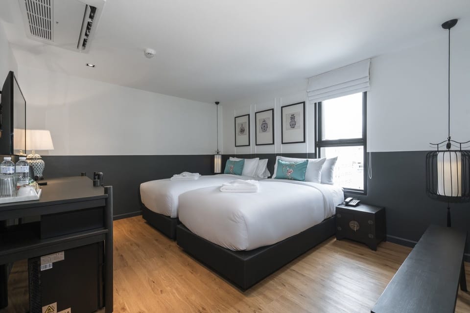 Deluxe Twin Room | Minibar, in-room safe, desk, iron/ironing board (on request)
