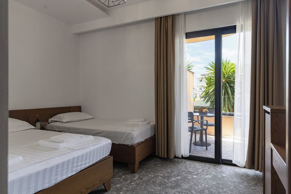 Triple Room, Balcony | Desk, free WiFi, bed sheets