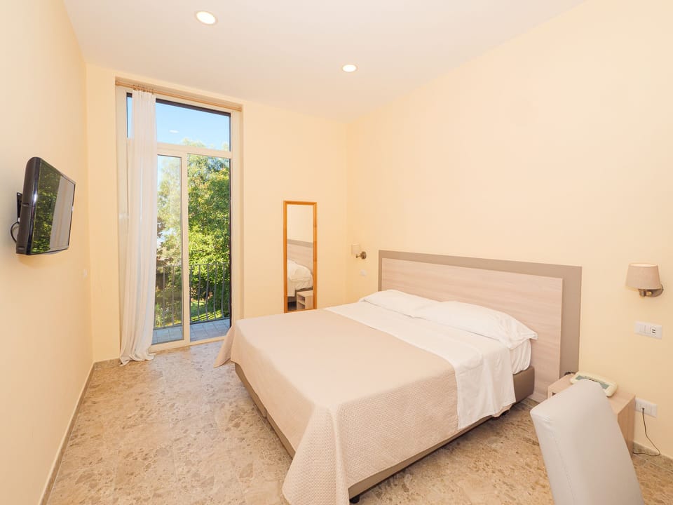 Superior Room, Pool View | In-room safe, desk, iron/ironing board, travel crib