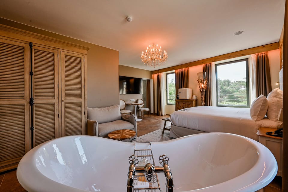Junior Suite, 1 King Bed (Hameau) | Bathroom | Free toiletries, hair dryer, bathrobes, slippers
