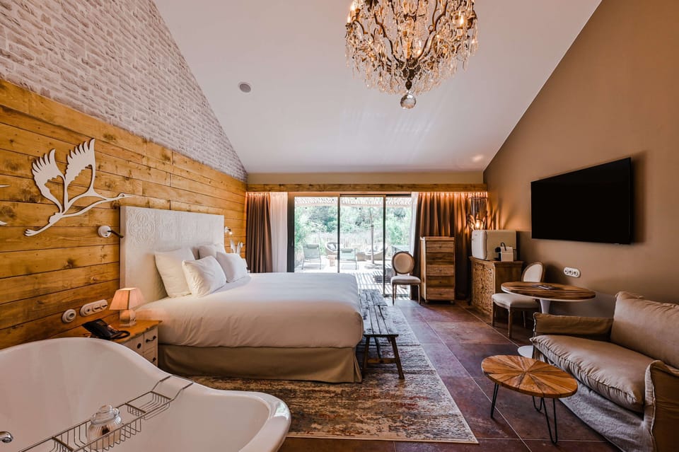 Room, 1 King Bed (Pesquiers By The Beach) | Free minibar, in-room safe, soundproofing, iron/ironing board