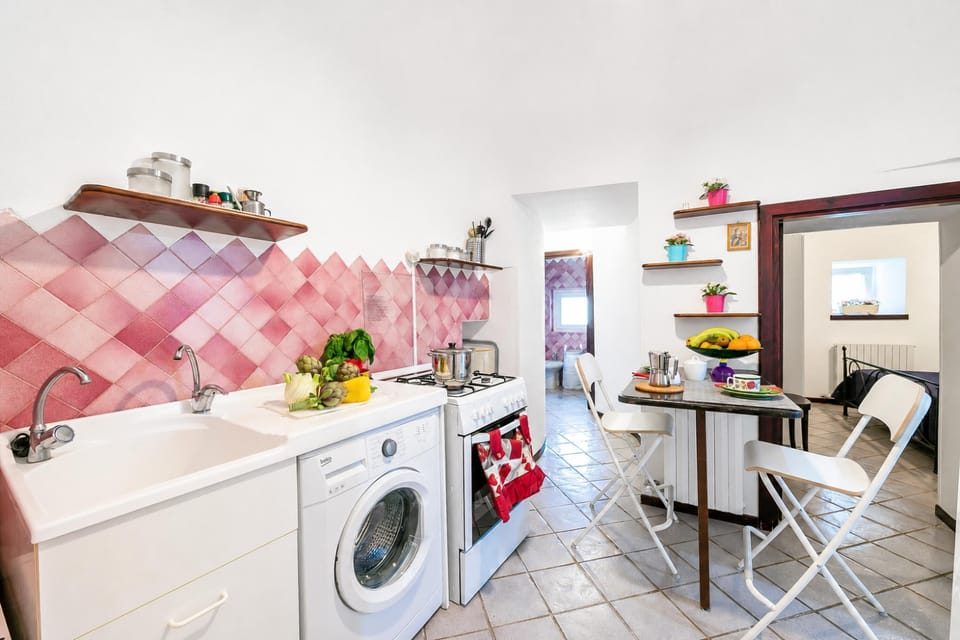Family Apartment, 2 Bedrooms, Fireplace (La Casa Sulla Roccia Trulli Pool) | Private kitchen | Stovetop, dining tables