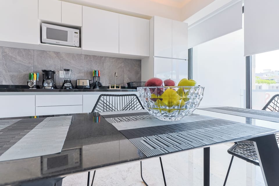 Deluxe Suite | Living area | 50-inch TV with digital channels, streaming services