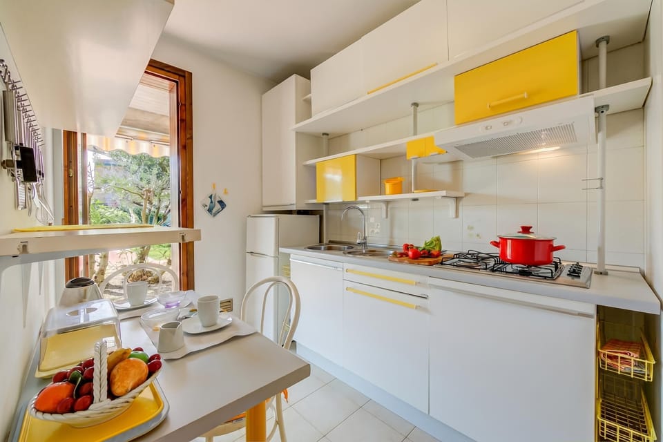 Family Apartment, 2 Bedrooms, Microwave (Cinzia Apartment Front Beach) | Private kitchen | Fridge, microwave, stovetop, cookware/dishes/utensils