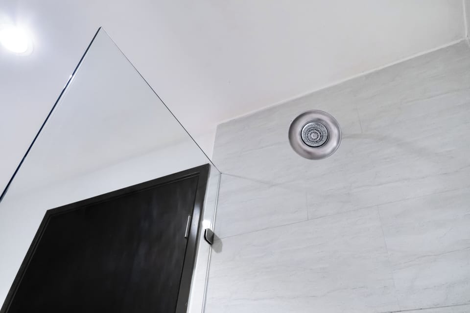 Rainfall showerhead, eco-friendly toiletries, hair dryer, towels