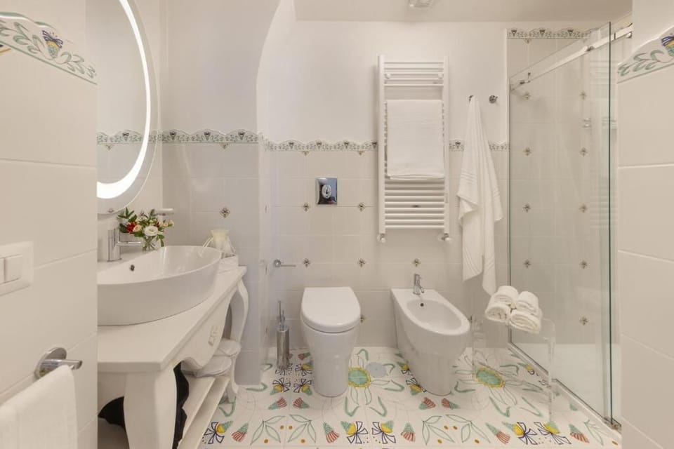 Luxury Room | Bathroom | Shower, rainfall showerhead, designer toiletries, hair dryer