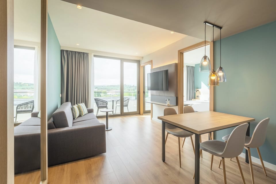 King Suite: Suite, Multiple Beds, Balcony | In-room safe, desk, laptop workspace, blackout drapes