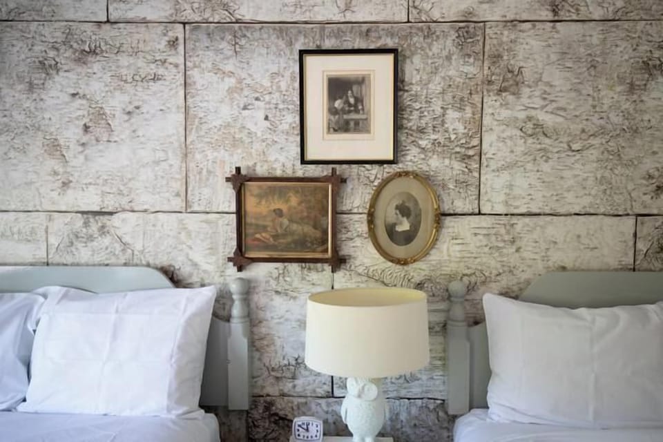 Desk, laptop workspace, iron/ironing board, free cribs/infant beds