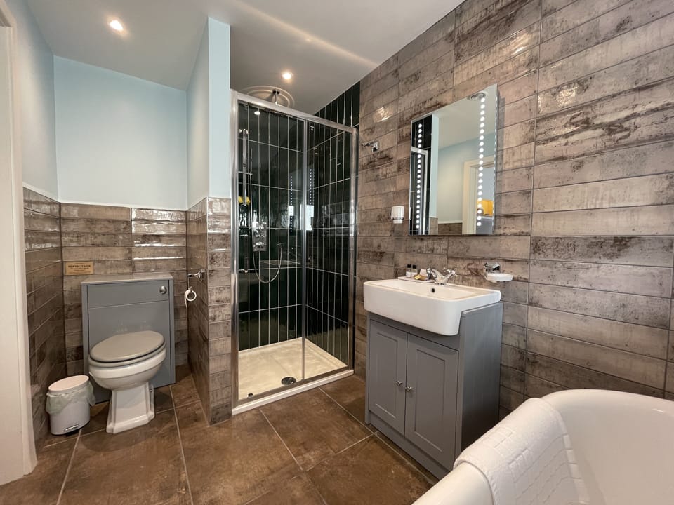 Designer toiletries, hair dryer, bathrobes, towels