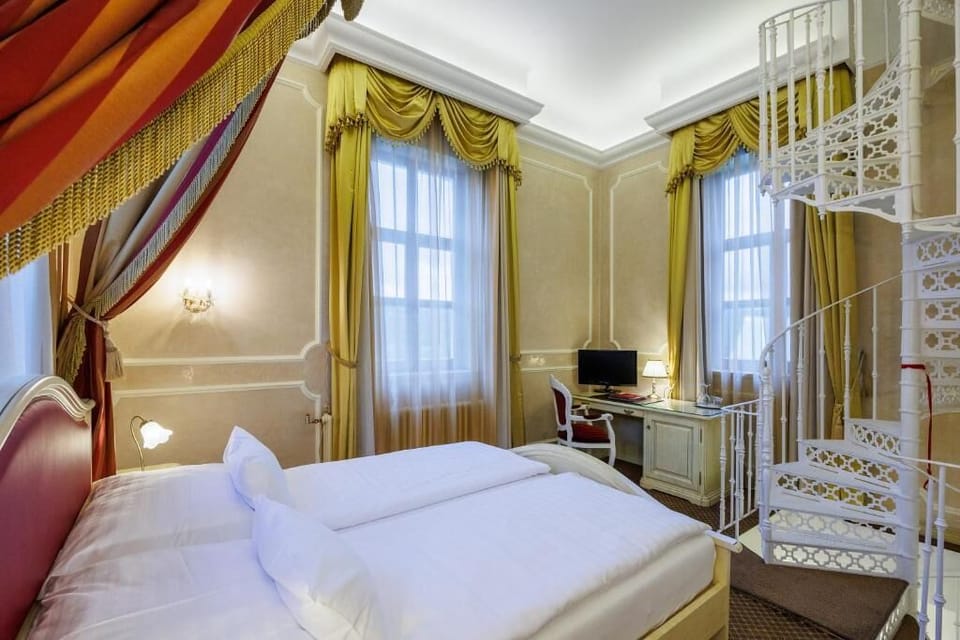 Luxury Suite, Garden View | Minibar, in-room safe, individually decorated, desk