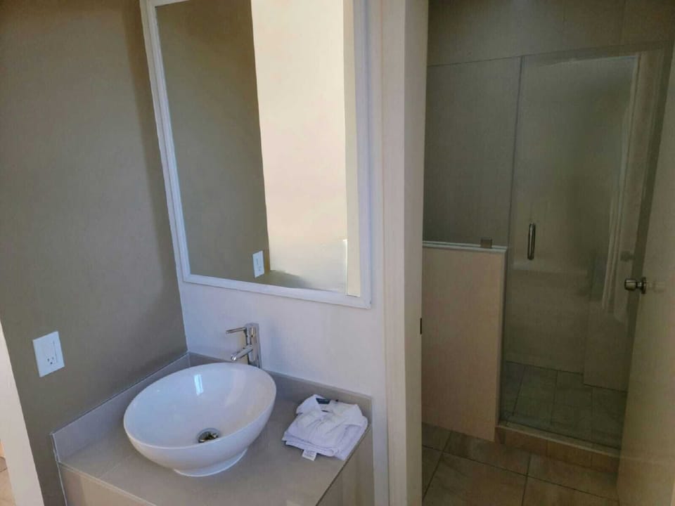 Family Double Room, 2 Double Beds | Bathroom | Shower, hair dryer, towels, soap