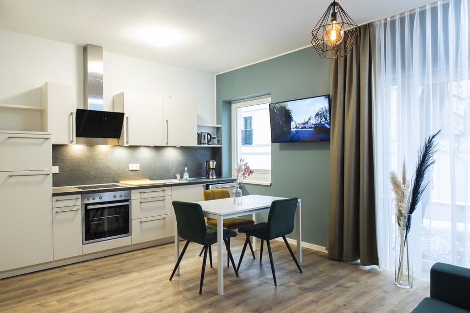 Comfort Apartment | Private kitchen | Electric kettle, highchair