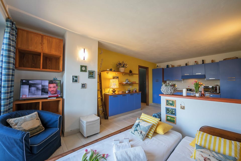 Family Apartment, Multiple Bedrooms (Rebecca's House (few steps from) | Living area | 21-inch TV with cable channels