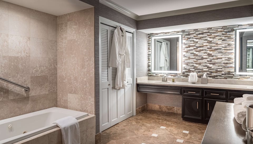 Suite, 1 King Bed, Non Smoking | Bathroom | Shower, free toiletries, hair dryer, towels