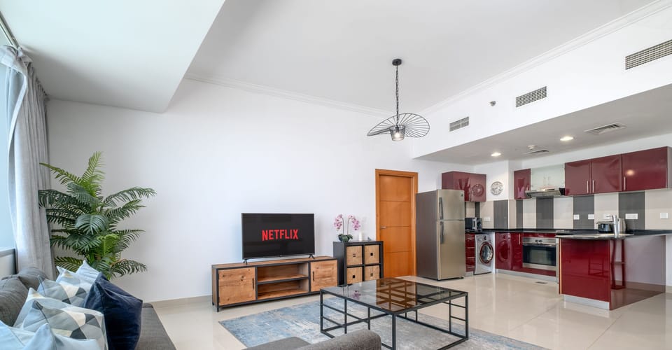Deluxe Apartment | Living area | 55-cm Smart TV with cable channels, TV
