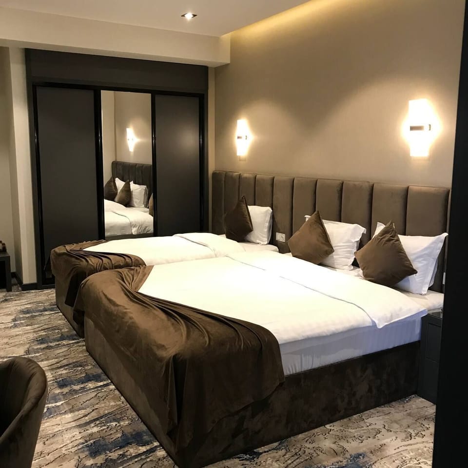 Family Quadruple Room, 2 Bedrooms | Minibar, in-room safe, iron/ironing board, WiFi (free)