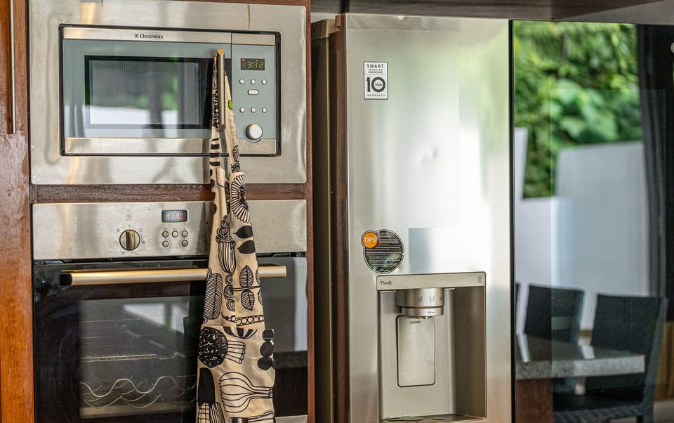 Luxury Villa | Private kitchen | Full-size fridge, microwave, oven, stovetop