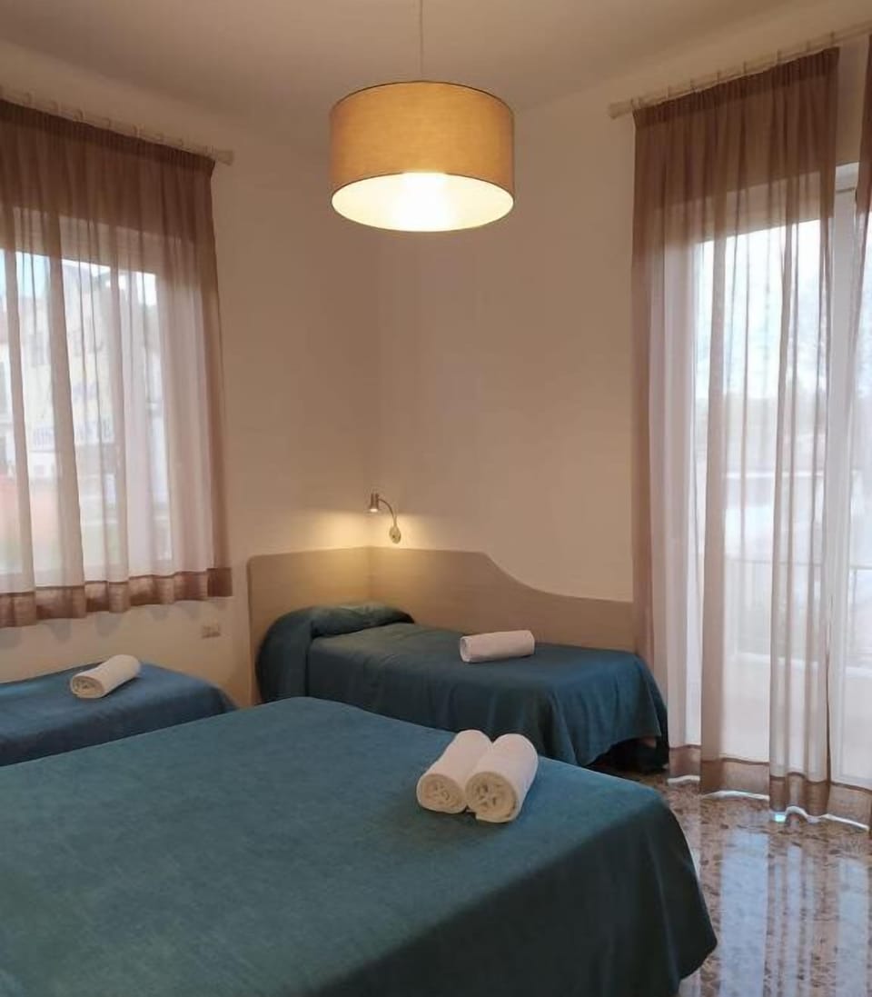 Memory foam beds, desk, WiFi (free), bed sheets