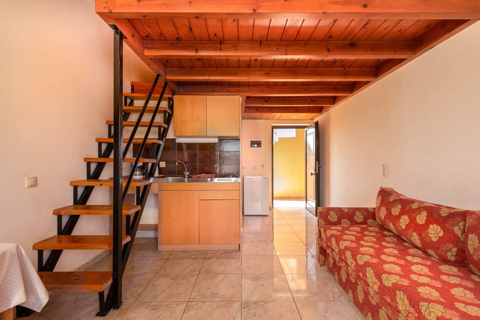 Duplex Family Maisonette | Living area | LCD TV, books