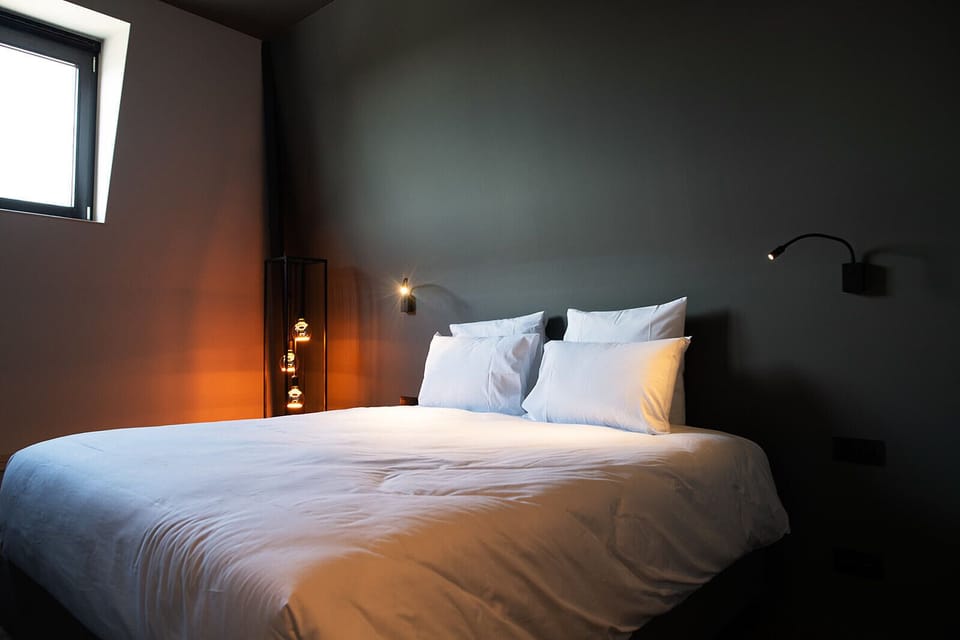 Comfort Room | Premium bedding, desk, laptop workspace, blackout drapes