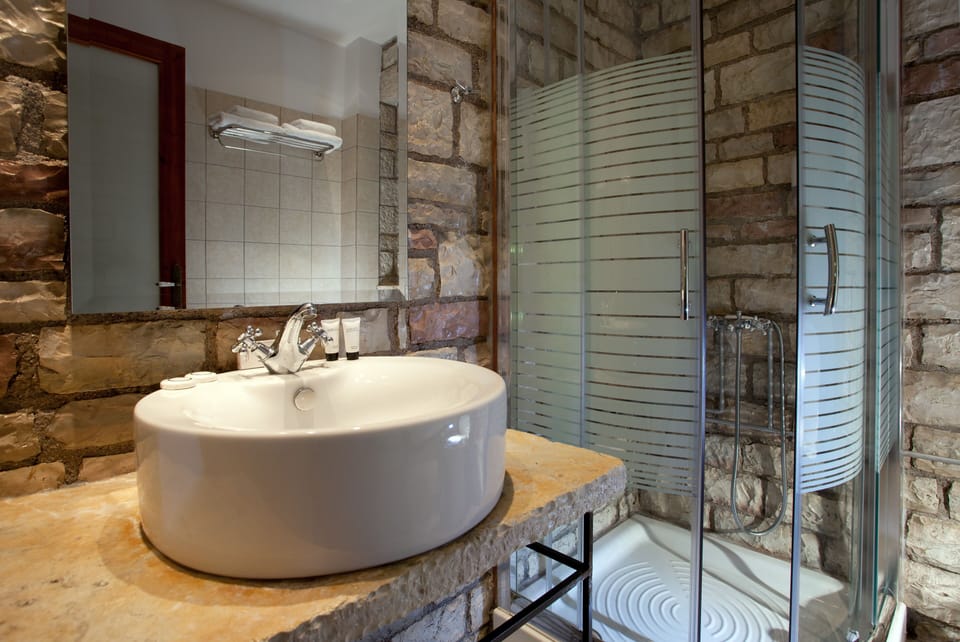 Shower, hair dryer, slippers, towels