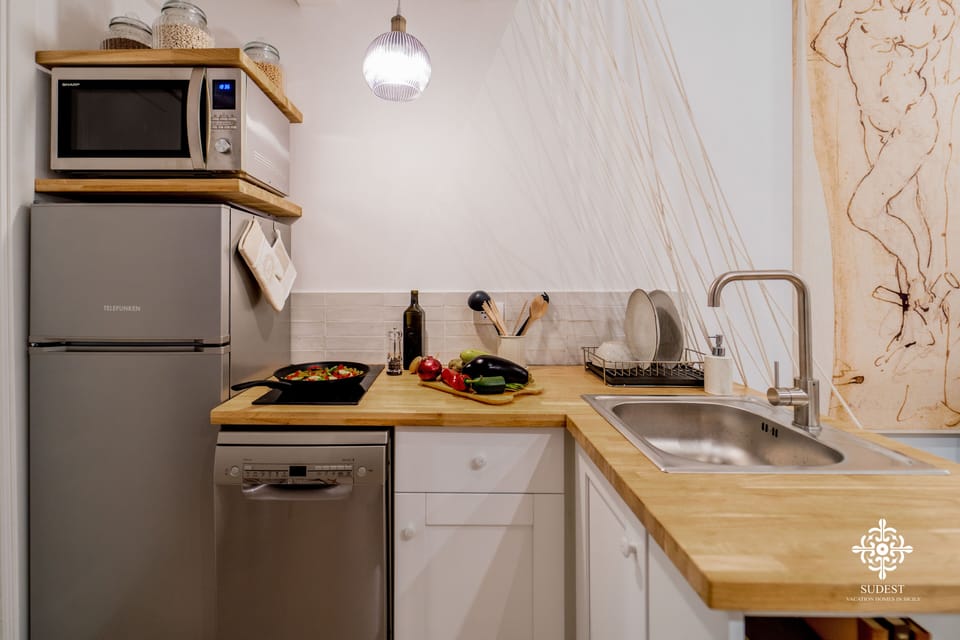 Exclusive Apartment | Private kitchen | Fridge, coffee/tea maker, highchair, dining tables