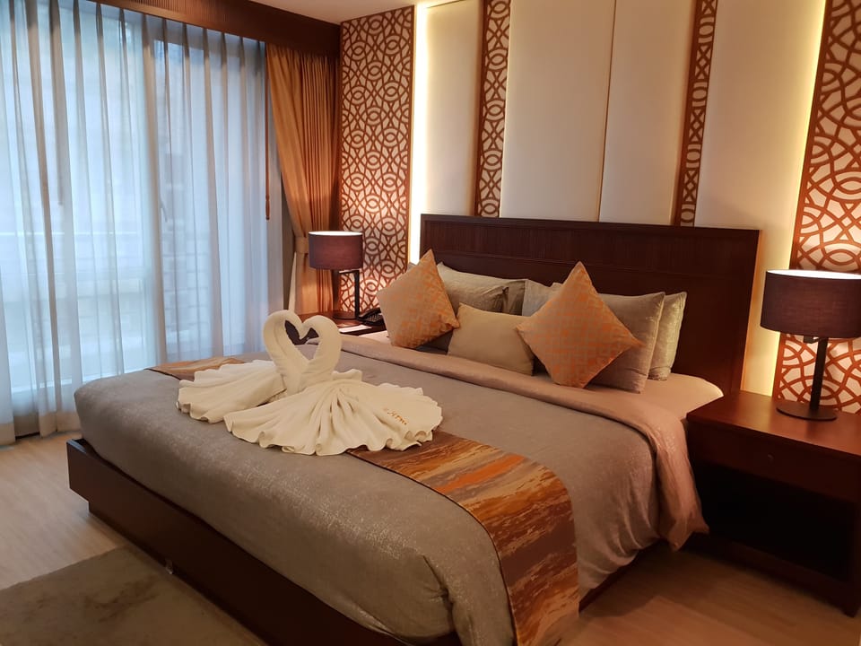 Suite, 1 Bedroom | Desk, blackout drapes, iron/ironing board, free WiFi