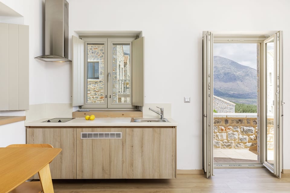 Executive Suite with Balcony | Private kitchen | Coffee/tea maker