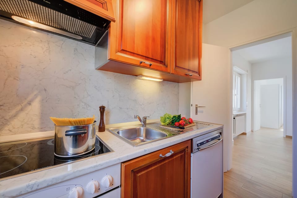 Standard Apartment, 2 Bedrooms, Balcony, Mountainside (Ca' Gina Panoramica - Monte Brè) | Private kitchen | Espresso maker, coffee/tea maker, electric kettle, dining tables