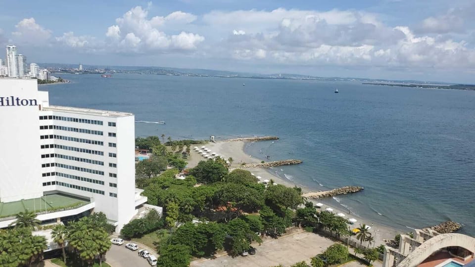 Panoramic Apartment | Living area | Flat-screen TV