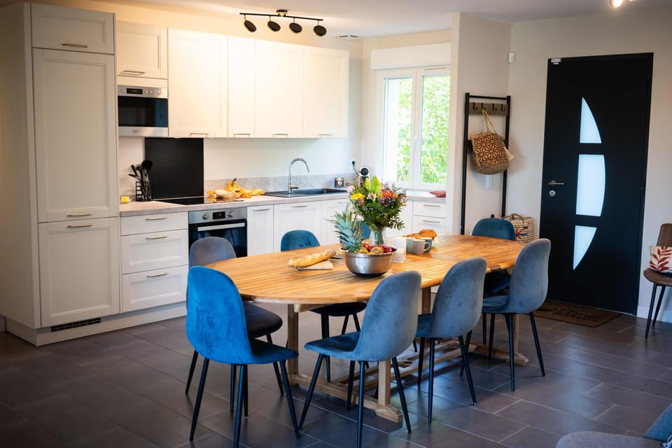 La Suite Roselière | Private kitchen | Cleaning supplies, dining tables