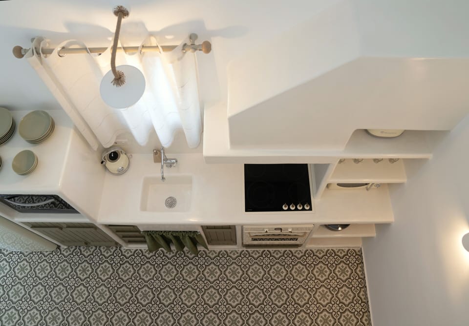 Suite, Private Pool | Private kitchen | Microwave, stovetop, electric kettle, toaster