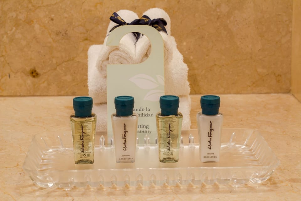 Designer toiletries, hair dryer, bathrobes, slippers