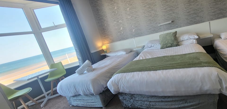 Family Room, Sea View (2 adults + 2 children) | Iron/ironing board, free WiFi, bed sheets
