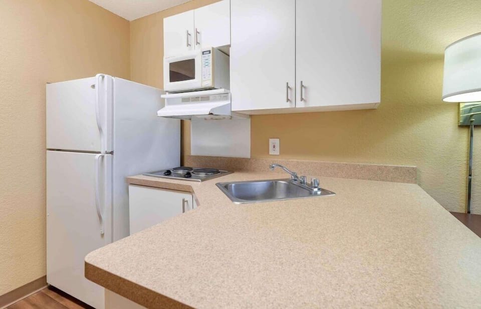 Fridge, microwave, stovetop, coffee/tea maker