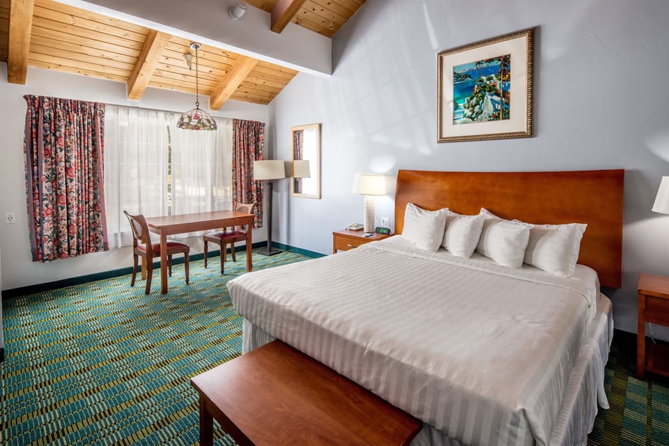 Desk, laptop workspace, blackout drapes, iron/ironing board