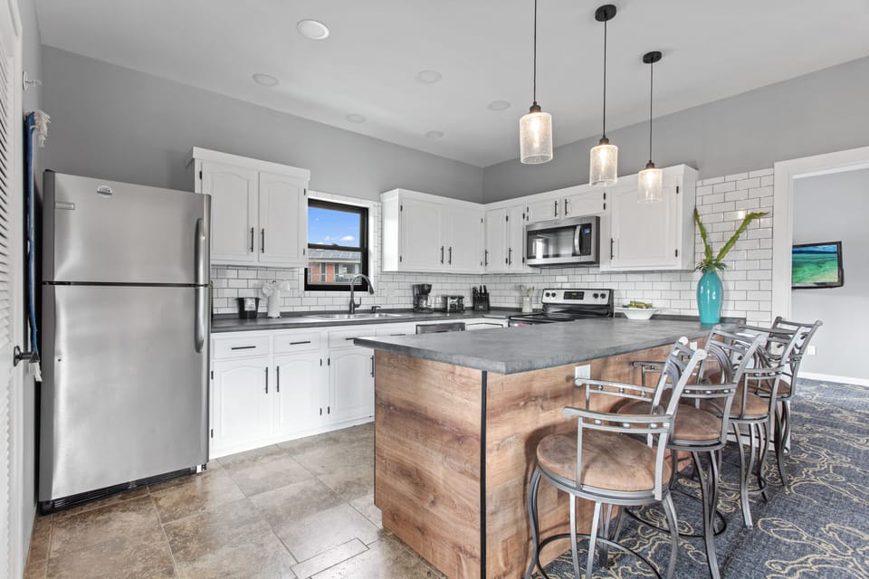 Exclusive Condo, 2 Bedrooms, Fireplace | Minibar, desk, laptop workspace, iron/ironing board