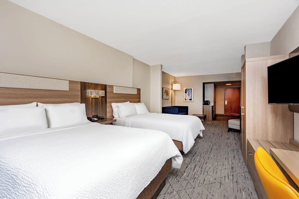 Suite, 2 Queen Beds | In-room safe, desk, iron/ironing board, cribs/infant beds