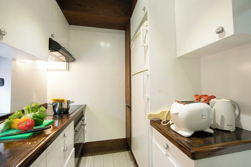 Family Apartment, 2 Bedrooms, Microwave (Melide On The Lake) | Private kitchen | Electric kettle, dining tables
