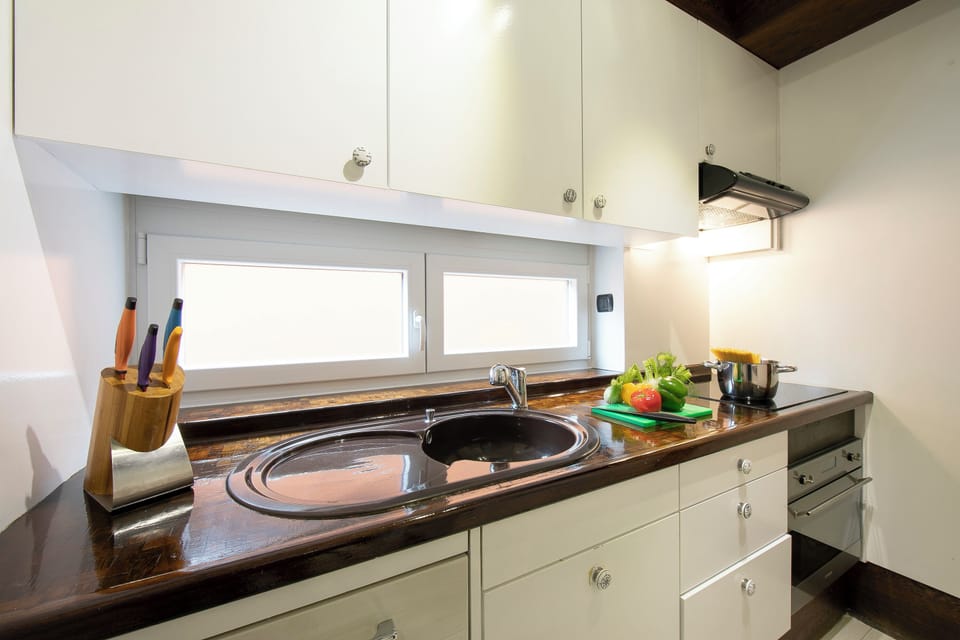 Family Apartment, 2 Bedrooms, Microwave (Melide On The Lake) | Private kitchen | Electric kettle, dining tables