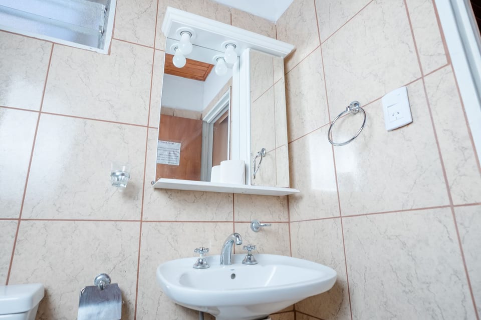 Shower, rainfall showerhead, bidet, towels