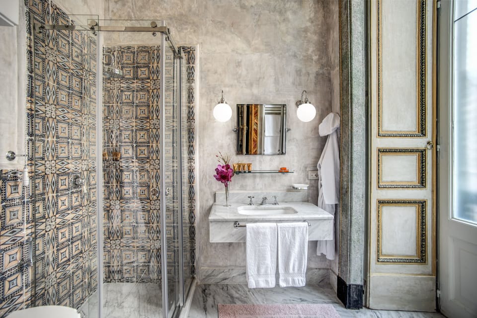 Shower, rainfall showerhead, designer toiletries, hair dryer