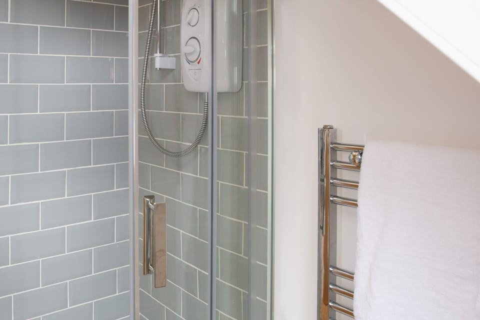Family Studio | Bathroom | Shower, hair dryer, towels