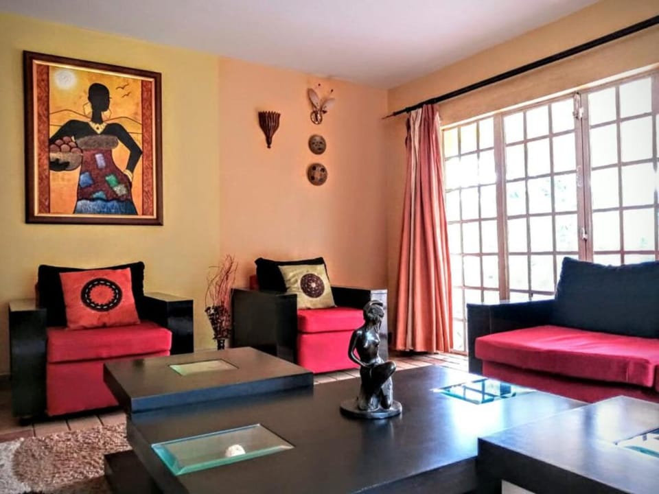 Apartment, 1 Bedroom | Living area | 32-inch flat-screen TV with digital channels